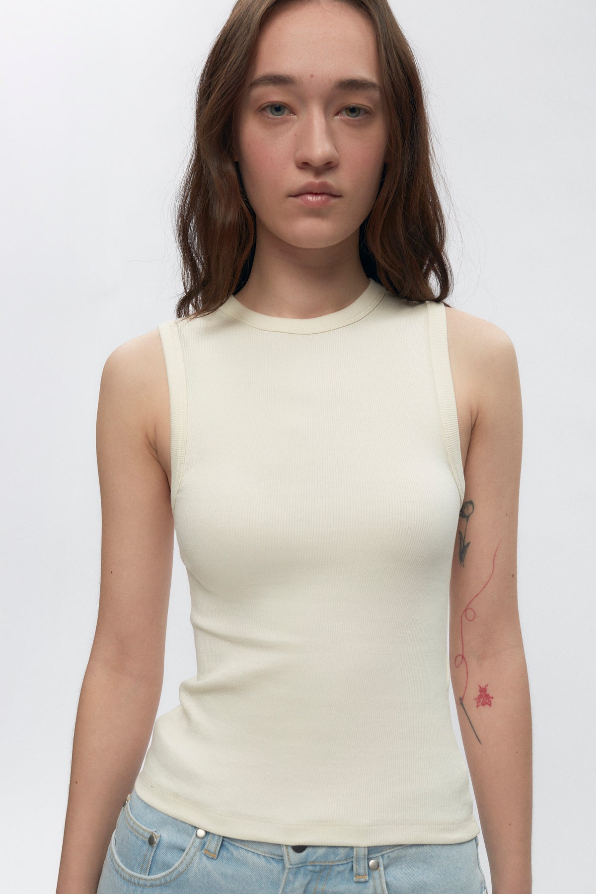 Elizabeth is 5’11" is a regular XS and is wearing an S.